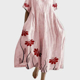 Rosa Kleid mit roten Blütenranken