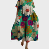 Türkises Kleid mit Blütenmuster