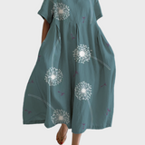 Petrolblaues Kleid mit Pusteblumen
