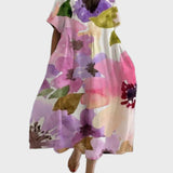 Cremefarbenes Kleid mit Aquarellblüten