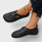 Notburga - Schwarze Slipper mit Schnürung